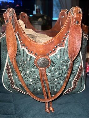 Very pretty hand tooled American west handbag  good used condition